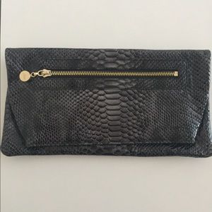 Faux snakeskin clutch. Excellent condition.